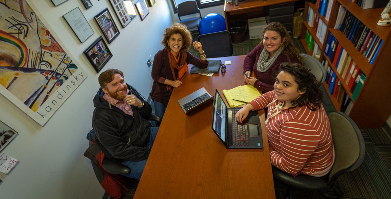 The INSIGHT team--including (clockwise from bottom left) Matthew Reimherr, Francesca Chiaromonte, Sarah Craig, Ana Kenney, and others--meets weekly to discuss exciting results as well as new challenges that their data present. Credit: Nate Follmer